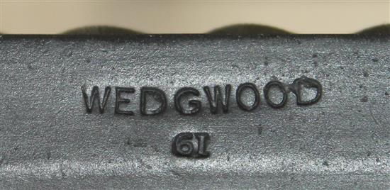 A pair of Wedgwood black basalt dolphin candlesticks, 21.5cm